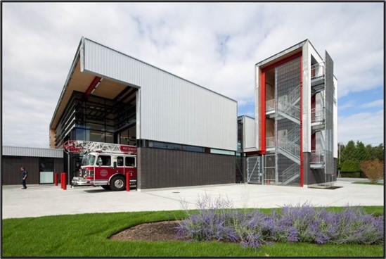 This Fire Hall has a concrete block structure with brick veneer cladding for a base of the exterior facade.