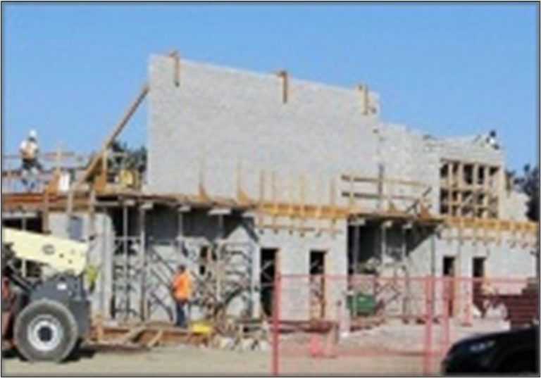 Concrete block structure under construction. High seismic capacity is provided by reinforced block walls utilizing high-strength units.