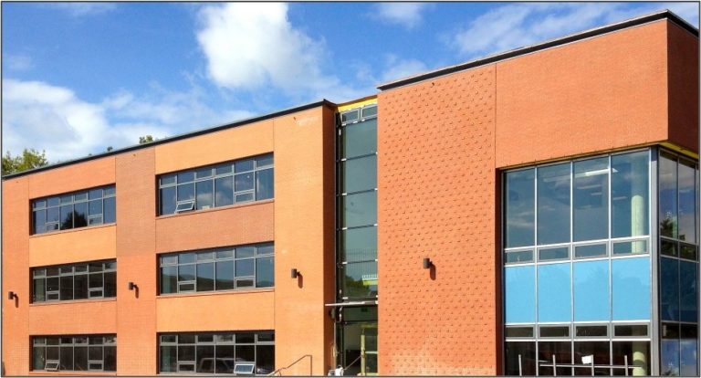The Masonry Institute of BC provided design input in the form of brick detail examples for this three-storey building that features a collage of three shades of brick laid in six different patterns.