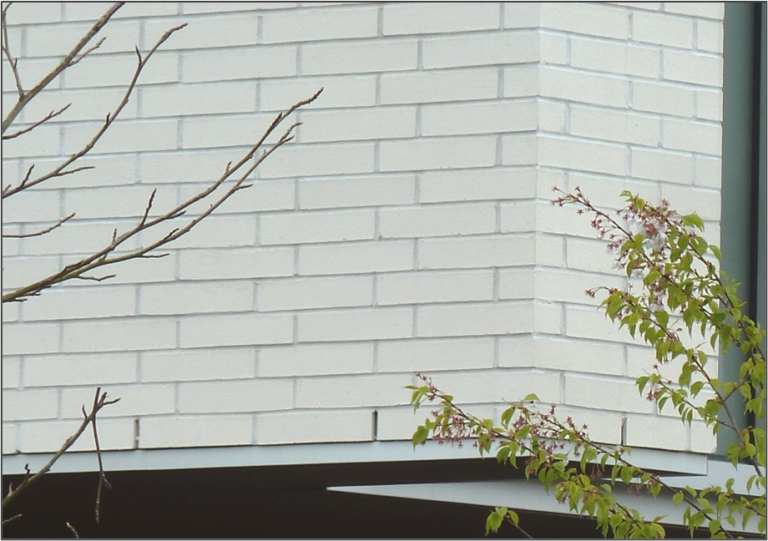 12” long brick units were installed in a 1/3 bond pattern.