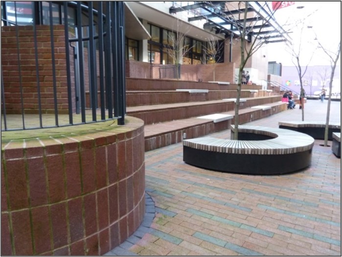 The brick design theme is extended into paving and landscaping applications.